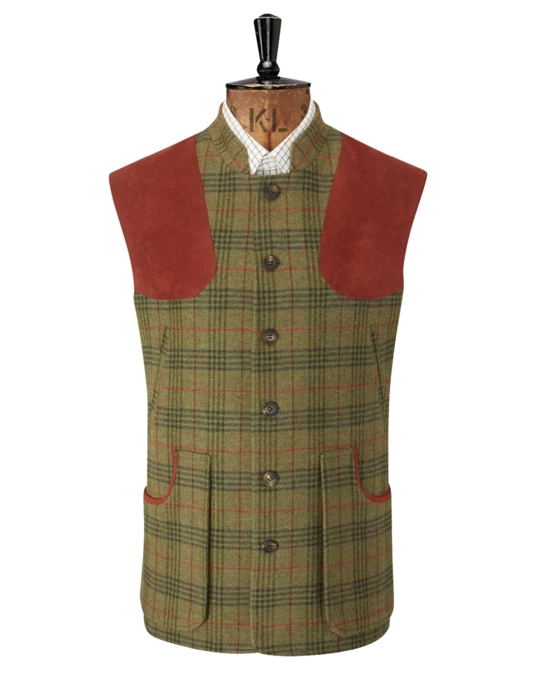 Tweed check gilet with red shoulder pads on a tailors mannequin