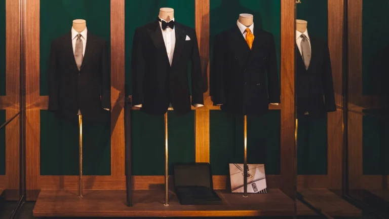 Four different types of suits on mannequins