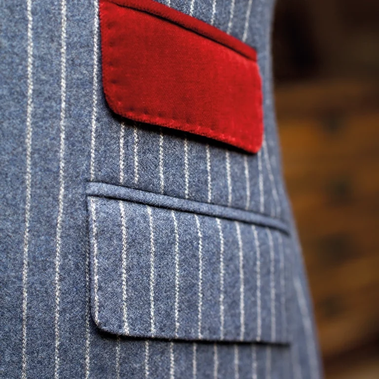 Close up of red pocket on a blue pinstriped suit from Tom Fox Bespoke Tailoring