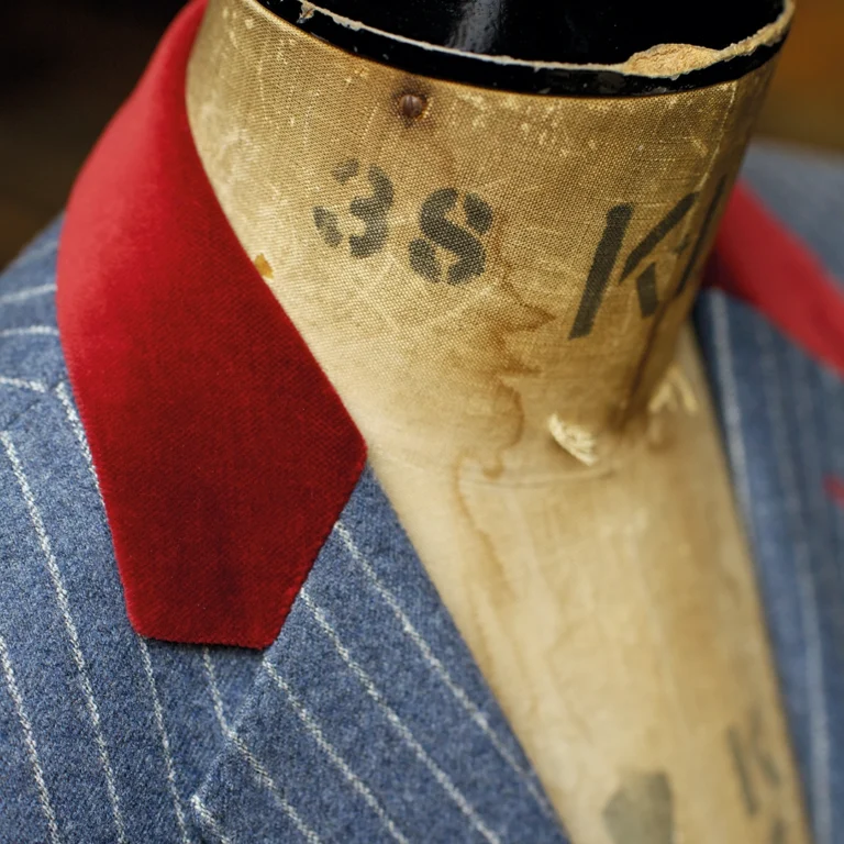 Blue pinstripe suit jacket with red velvet collar made by Tom Fox Bespoke Tailoring